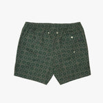 A pair of swim shorts in dark green with a repeating light green palm tree pattern, featuring a buttoned side pocket and drawstring waist