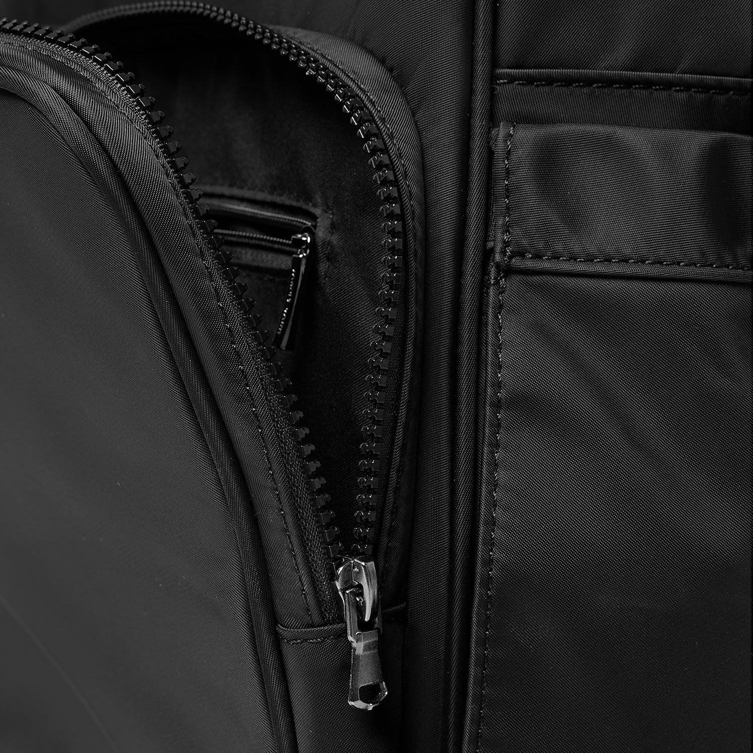 Macro shot of the premium silver-tone zipper pull