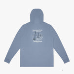 A light blue rashguard shown from the back, featuring a white graphic print of sailboats and the text 'SAILING CLUB' and 'JAMES BARK'.