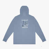 A light blue rashguard shown from the back, featuring a white graphic print of sailboats and the text 'SAILING CLUB' and 'JAMES BARK'.