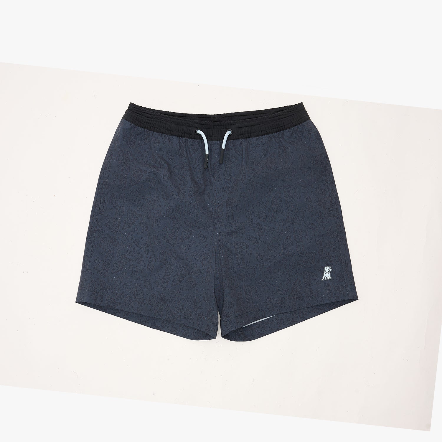 Dark navy blue athletic shorts with a black elastic waistband and white drawstrings, featuring a small white logo on the lower left leg