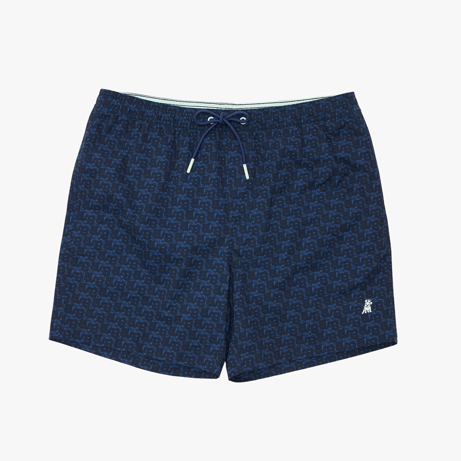 A pair of men's navy blue swim trunks featuring an all-over repeating monogram pattern, a white drawstring, and a small white embroidered logo on the lower left leg