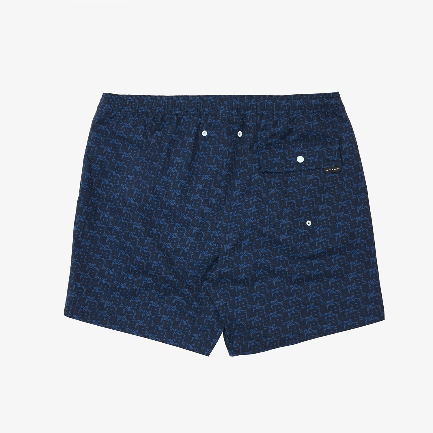 A pair of dark blue patterned swim trunks with a small white brand label on the right side, displayed flat