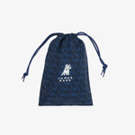 A dark blue drawstring pouch with a lighter blue geometric pattern and a white 'JAMES BARK' dog logo printed on the front
