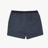 A pair of men's swim trunks in navy blue with a subtle tonal pattern, featuring a black elastic waistband and a side pocket