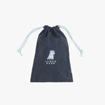 A dark navy blue drawstring pouch with a subtle tonal pattern, featuring a white dog illustration and the text 'JAMES BARK' printed on the front.