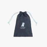 A dark navy blue drawstring pouch with a subtle tonal pattern, featuring a white dog illustration and the text 'JAMES BARK' printed on the front. The drawstrings are a contrasting light blue