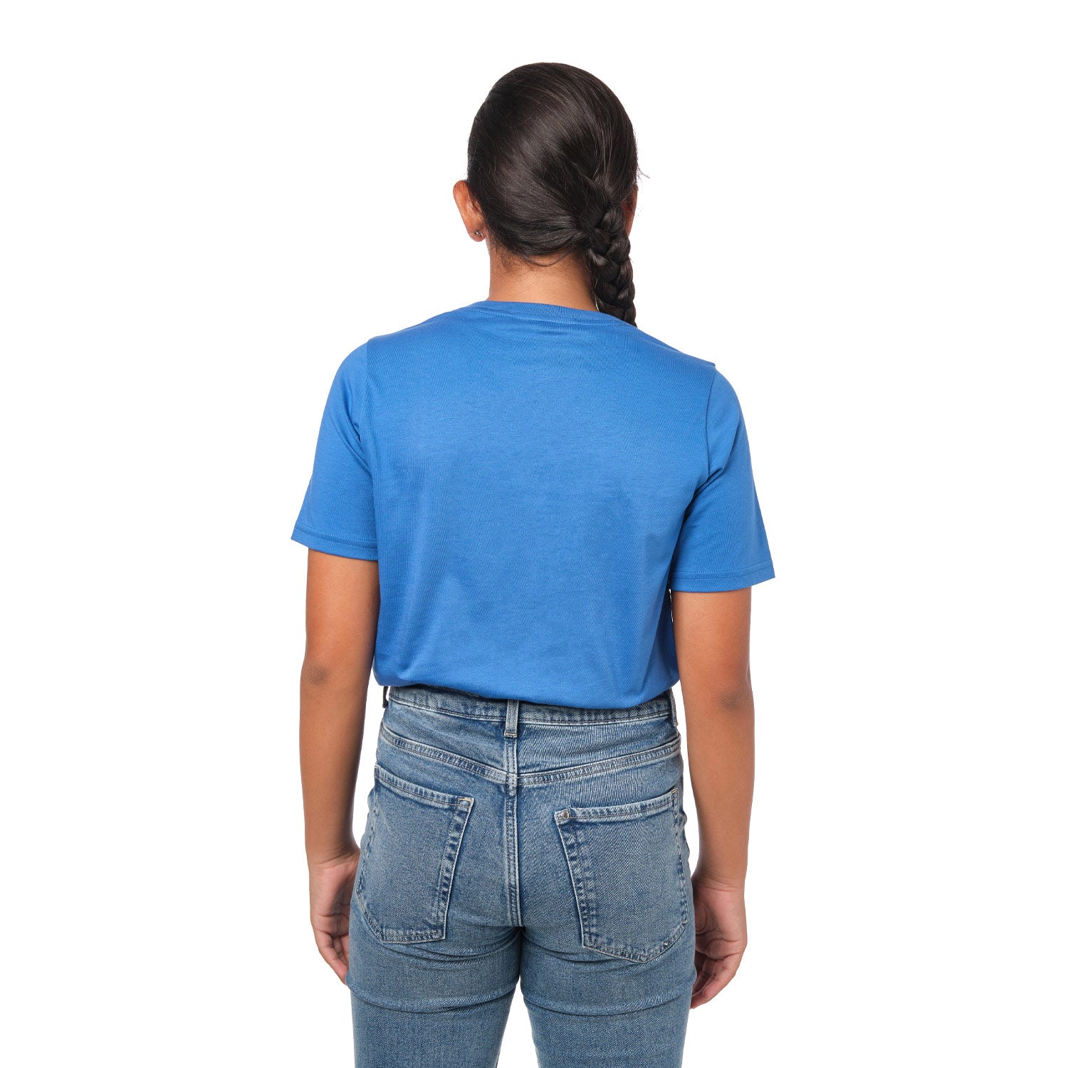 Rear view of a girl wearing the blue t-shirt, standing with her hands behind her back.