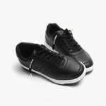 Pair of black leather sneakers with white soles with Black Laces