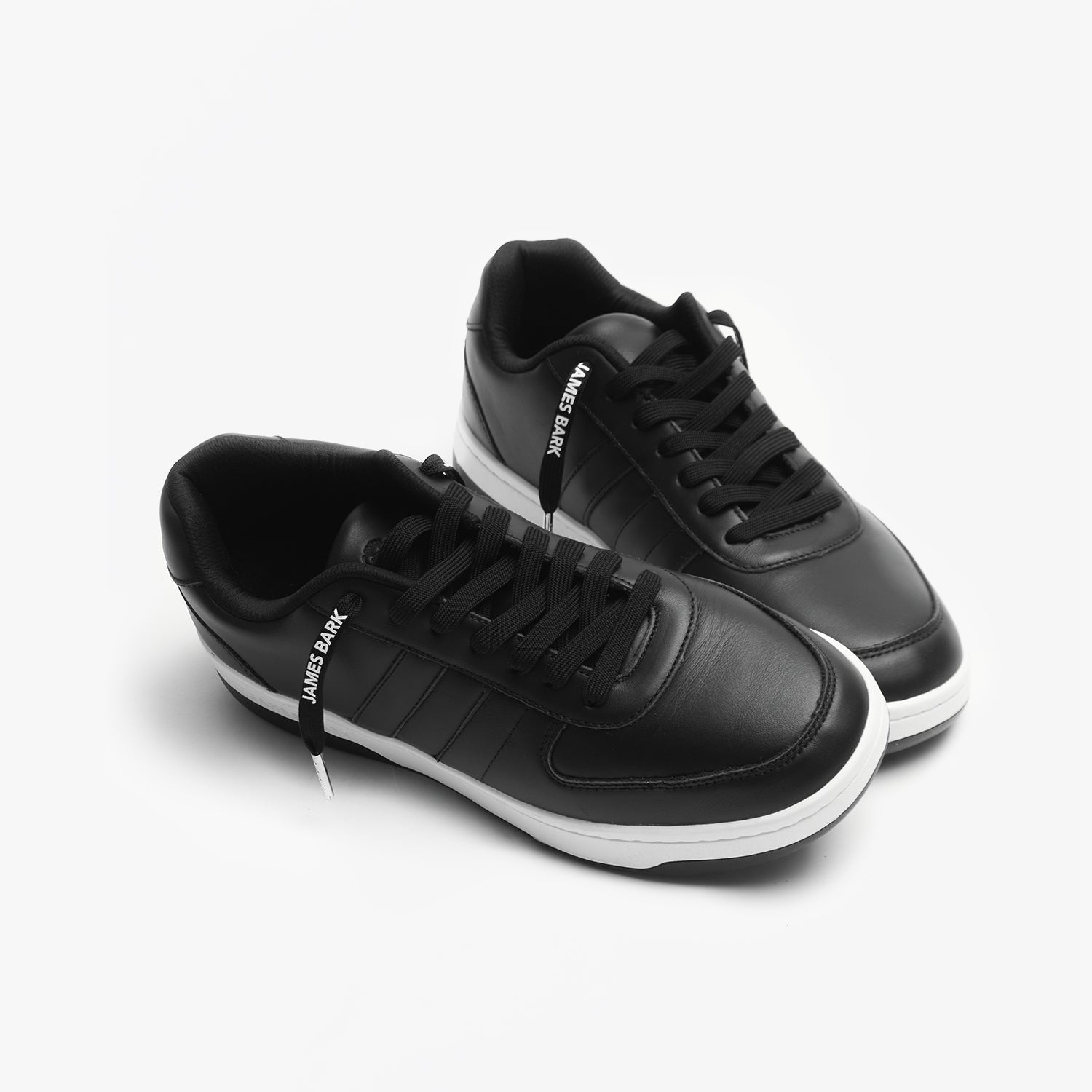 Pair of black leather sneakers with white soles with Black Laces