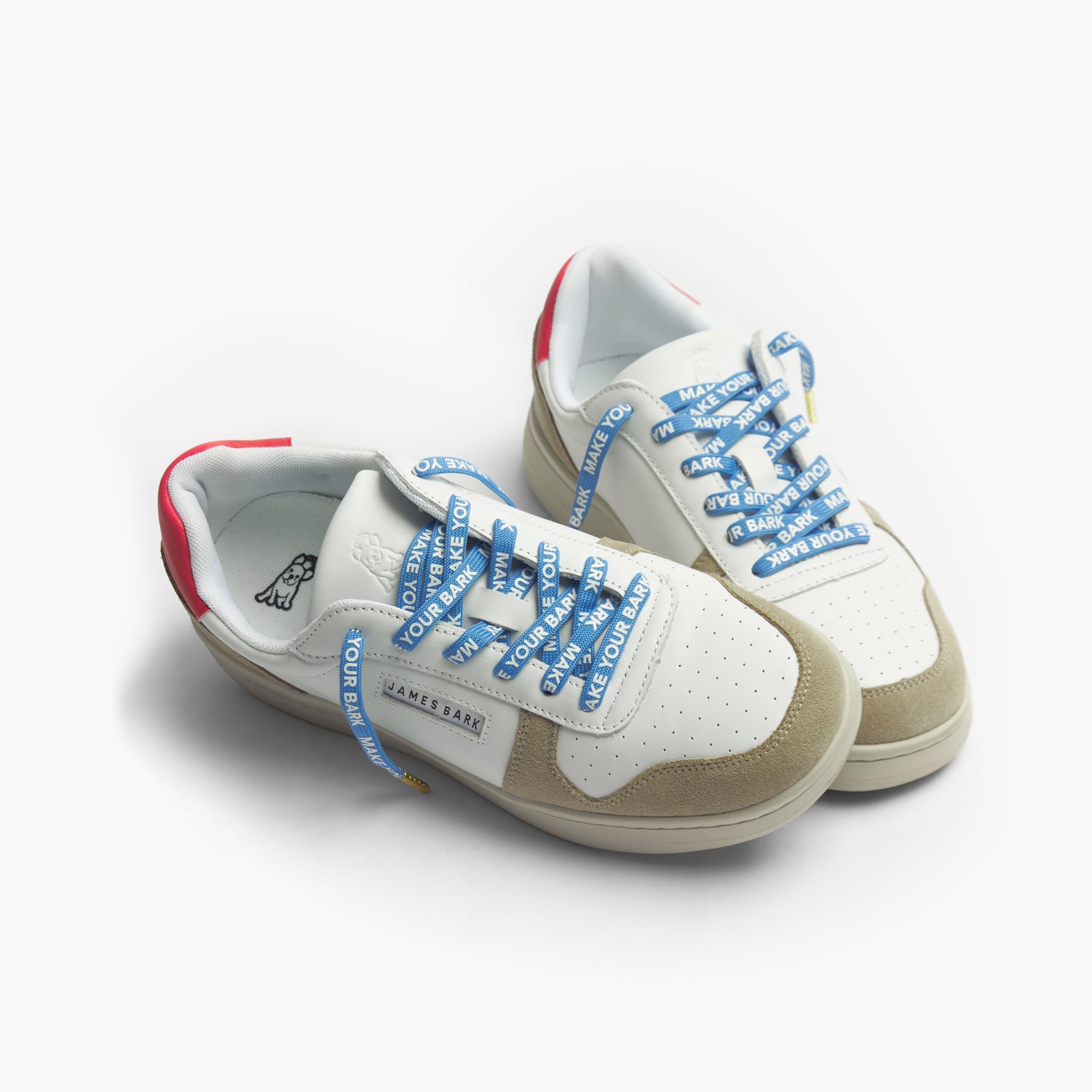 Sneakers with Tan, Red and Blue detailing and Blue Shoelaces displaying MAKE YOUR BARK
