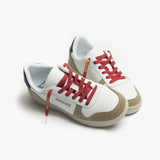 White and beige sneakers with maroon "Jetsetter" shoelaces