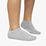 Gray ankle socks with a brand logo on a white background