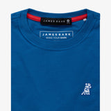 Close-up of the collar area of the blue t-shirt, showing the small white embroidered logo on the chest.