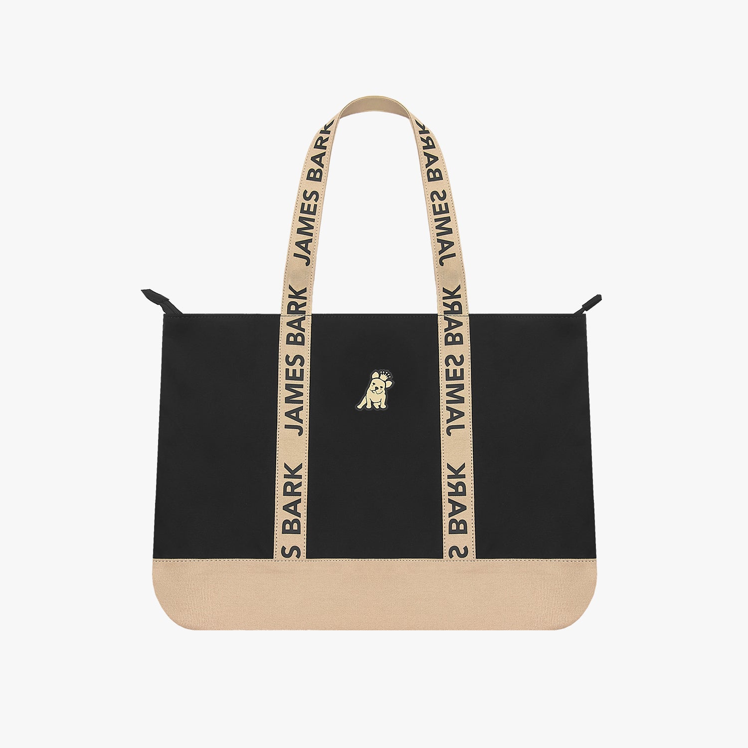 The James Bark tote bag in black with a tan bottom panel and matching tan branded straps