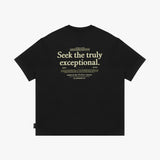 Back view of a black t-shirt laid flat, with a large "Seek the truly exceptional" graphic in off-white text