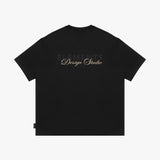 Black t-shirt with 'Elements Design Studio' text on a white background