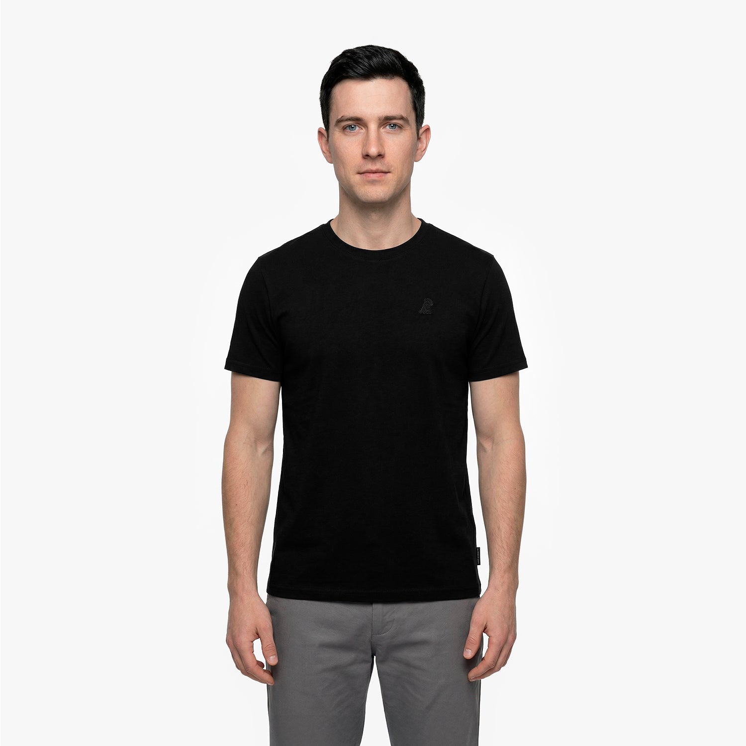 Man wearing a black t-shirt on a white background