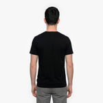 Back view of a man wearing a black t-shirt on a white background