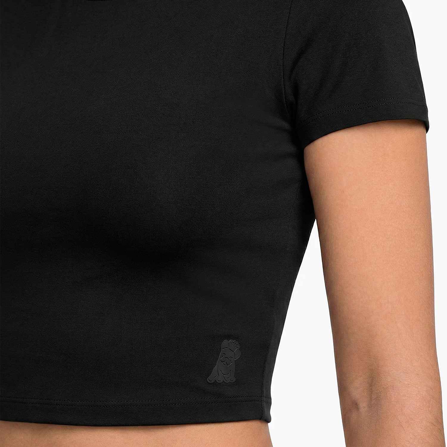 Black t-shirt with a small logo on a white background