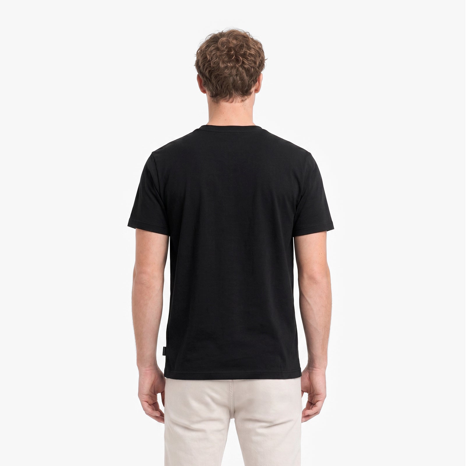 Man wearing a black t-shirt on a white background