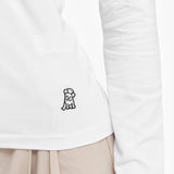Close-up of a white long-sleeve shirt with a small black logo on a white background