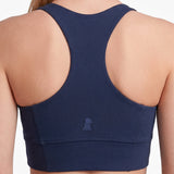 Navy blue sports bra with brand logo on a white background