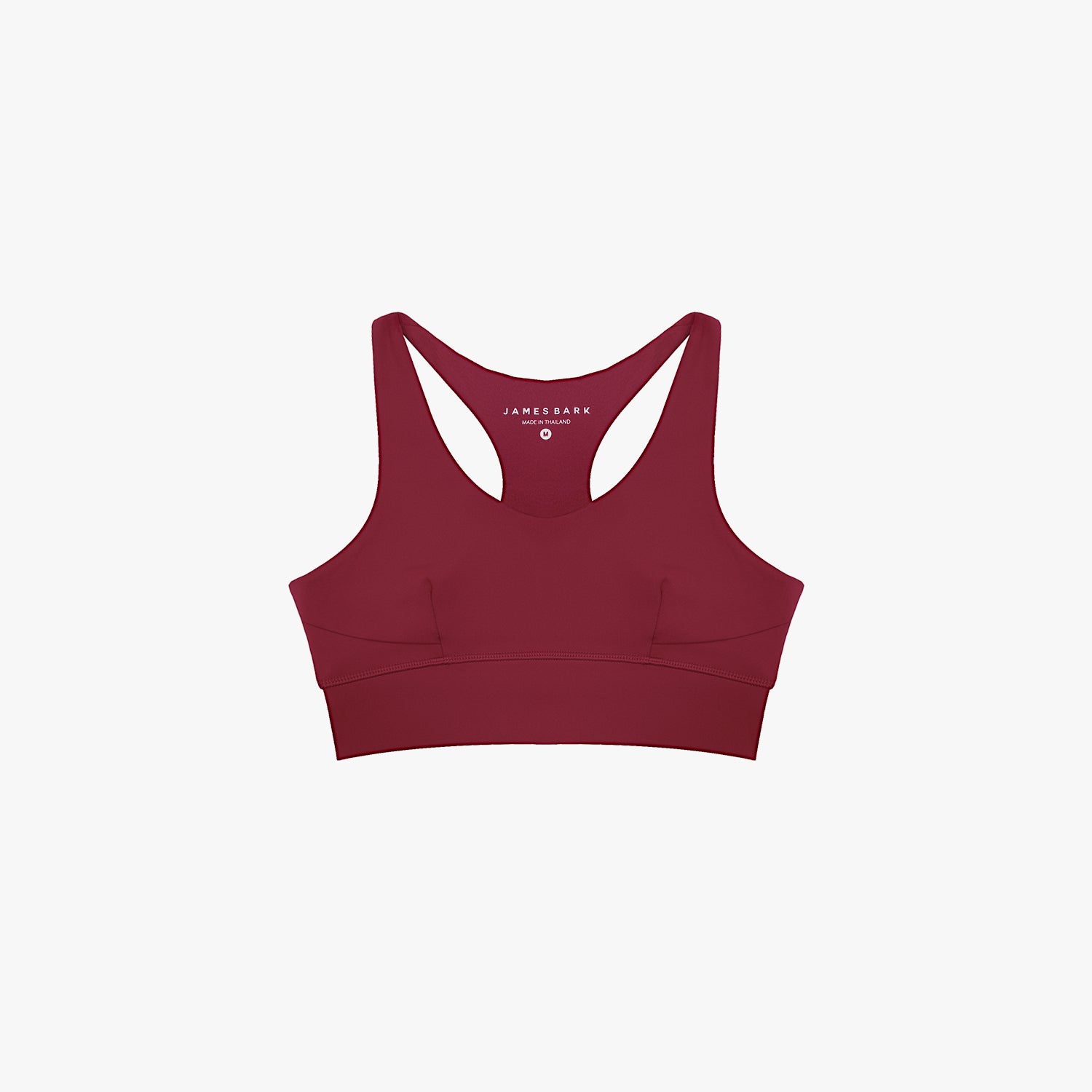 Red sports bra with 'James Bark' branding on a white background