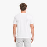 Man wearing a plain white t-shirt and light gray pants on a white background