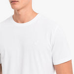 White t-shirt with a small logo on a white background