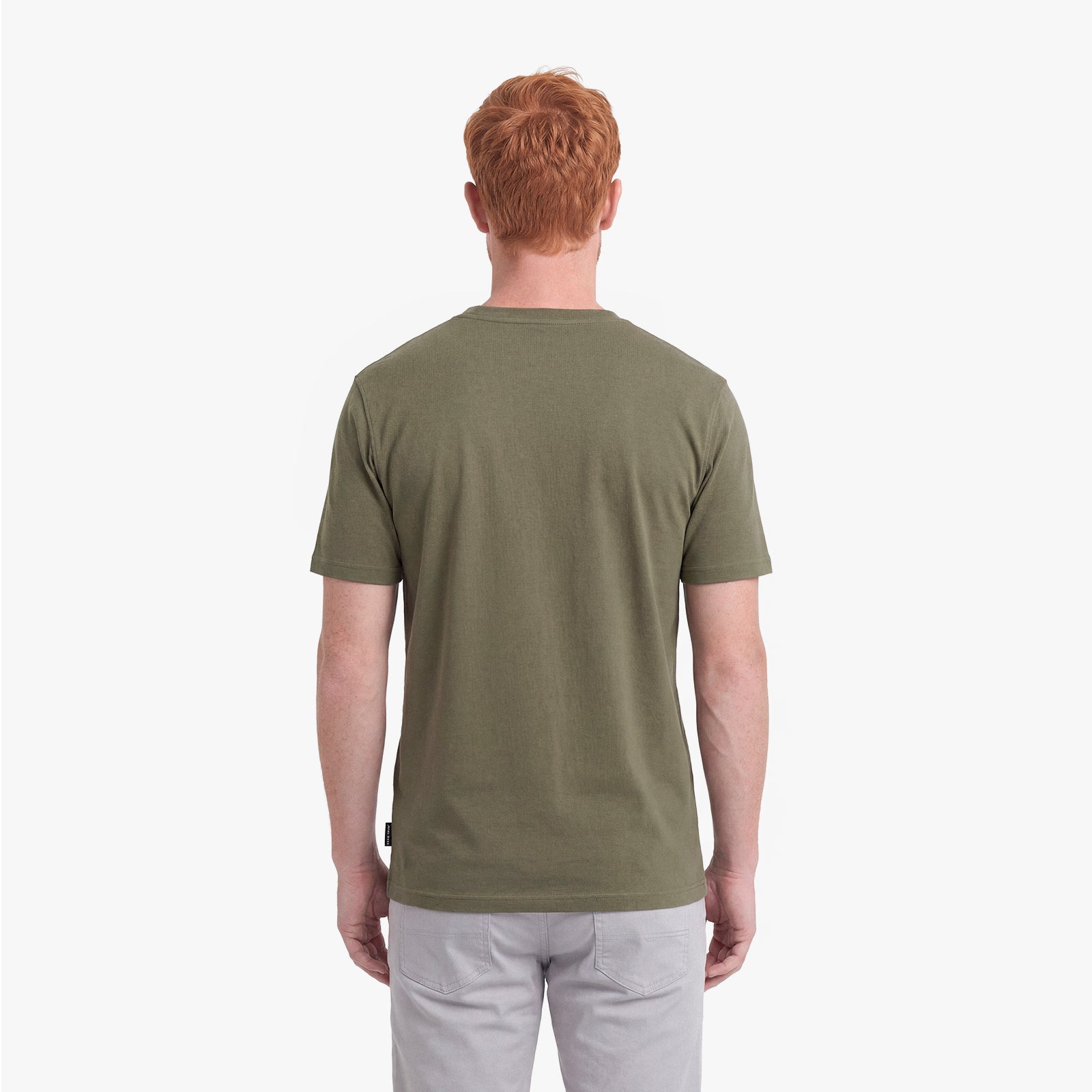 Man wearing a green t-shirt on a white background