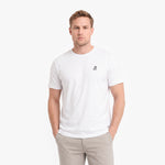 A man wearing a white short-sleeve crewneck t-shirt with a small embroidered logo