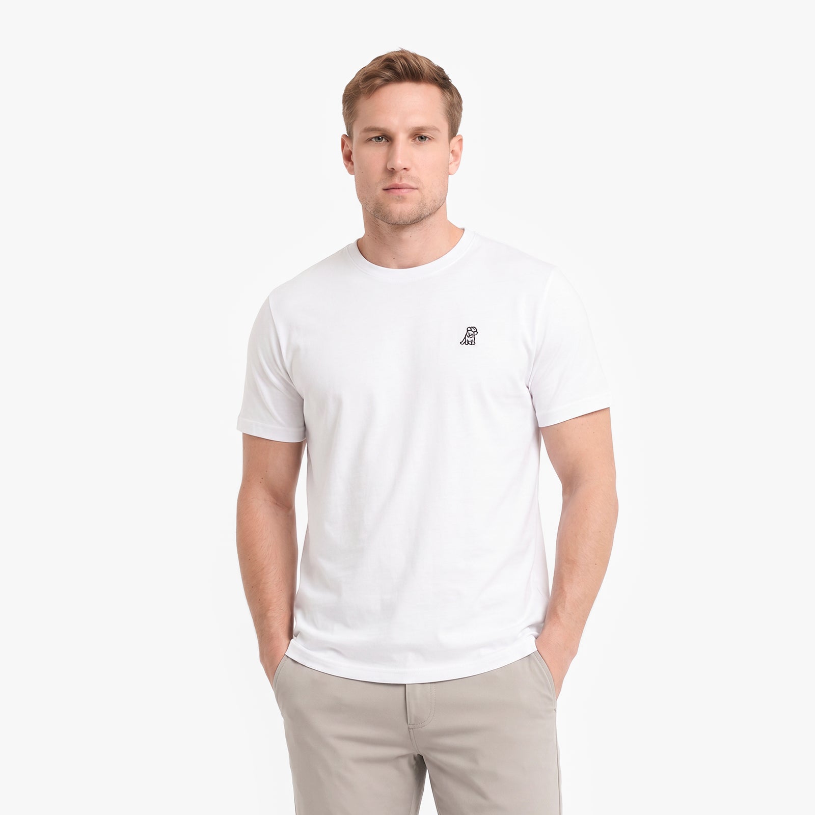 A man wearing a white short-sleeve crewneck t-shirt with a small embroidered logo