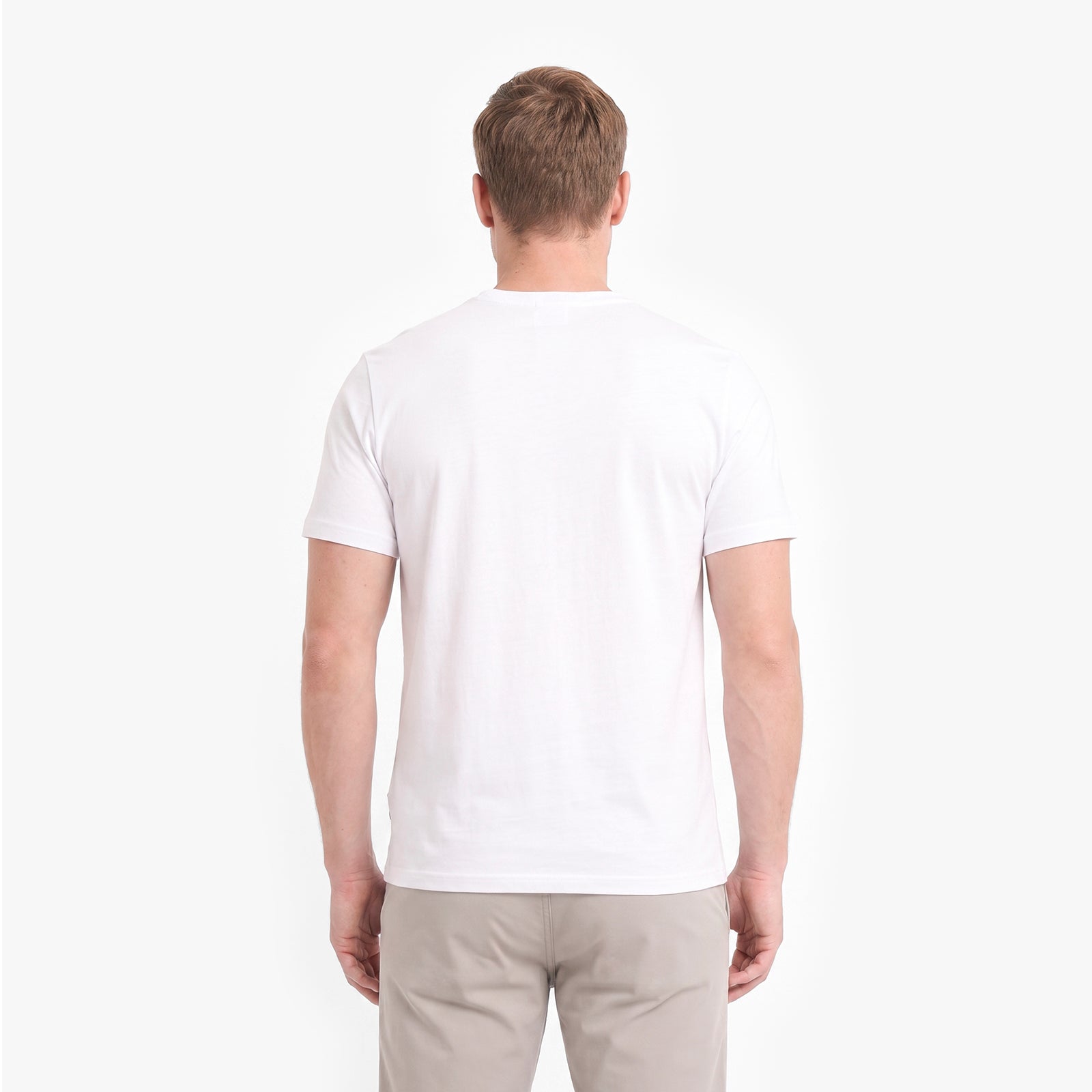 A man viewed from behind wearing a plain white short-sleeve crew-neck t-shirt