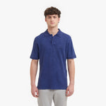 Man wearing a blue polo shirt on a white background