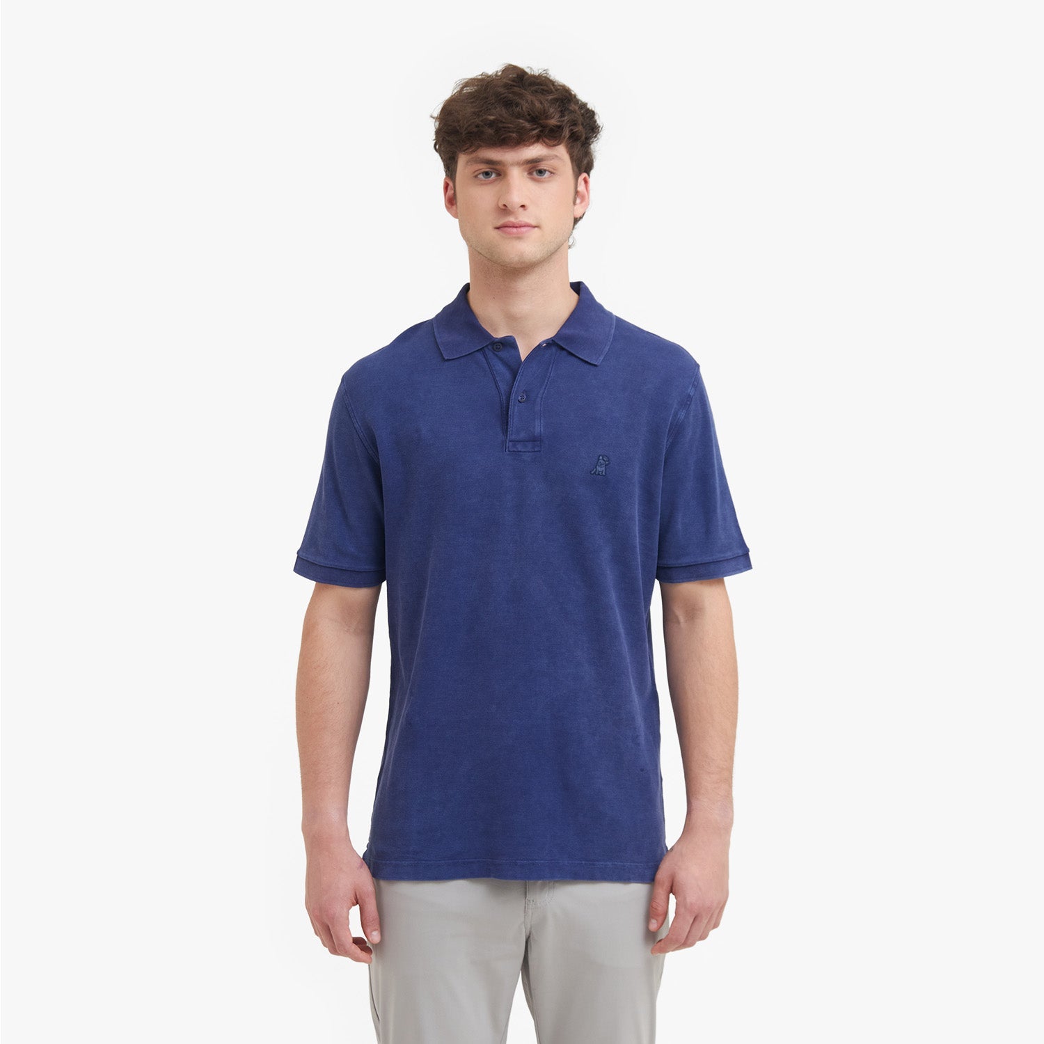 Man wearing a blue polo shirt on a white background