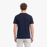 Man wearing a navy blue t-shirt on a white background