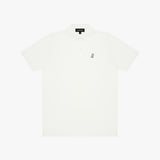 A short-sleeve polo shirt in off-white, featuring a small black embroidered logo on the left chest and a black neck label, displayed flat against a light gray background.