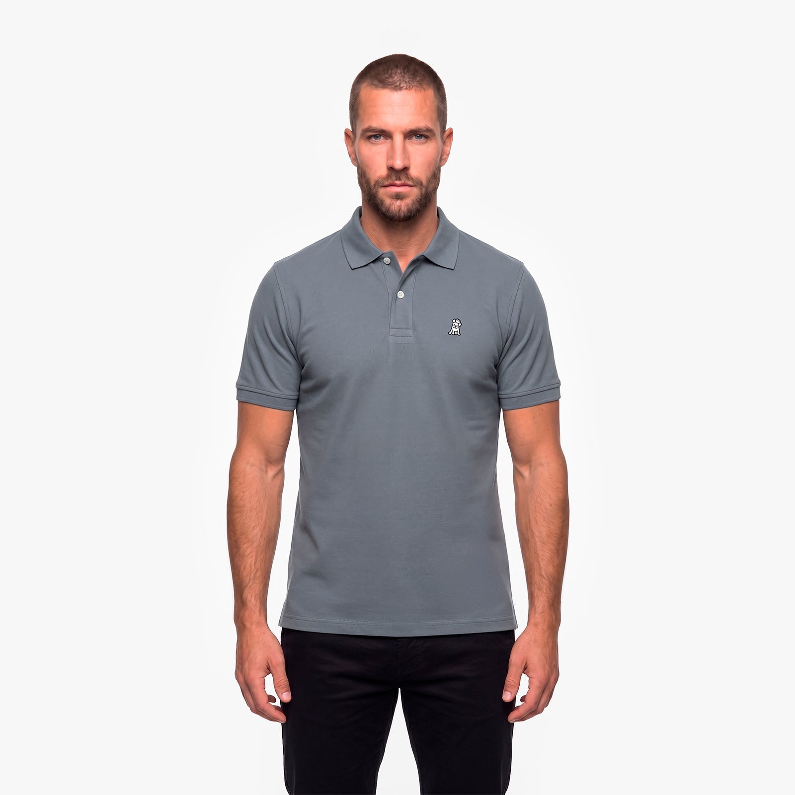 Man wearing a gray polo with a white embroidered logo on a white background