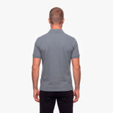 Man wearing a gray polo shirt on a white background