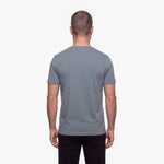Man wearing a gray t-shirt on a white background