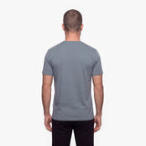 Man wearing a gray t-shirt on a white background