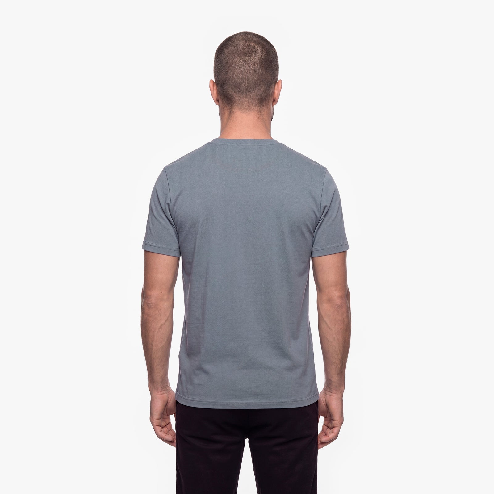 Man wearing a gray t-shirt on a white background