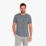 Man wearing a gray t-shirt on a white background