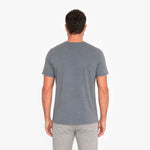 Man wearing a gray t-shirt on a white background