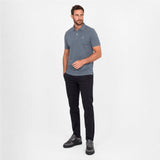 Man wearing a gray polo on a white background