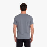 Man wearing a gray t-shirt on a white background