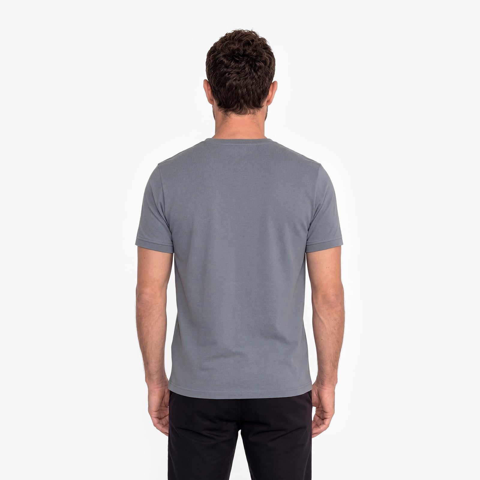 Man wearing a gray t-shirt on a white background