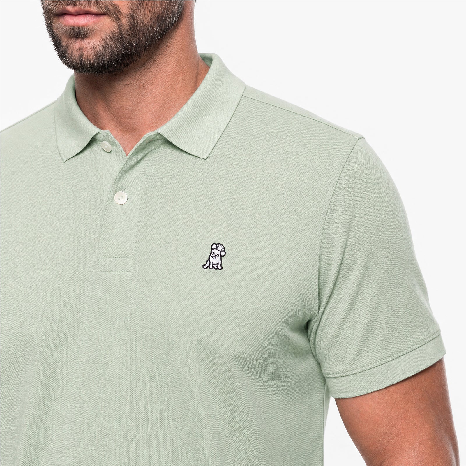 Light green polo shirt with a small logo on a white background