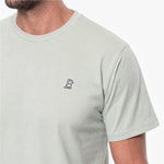 Light gray t-shirt with a small logo on the chest against a white background